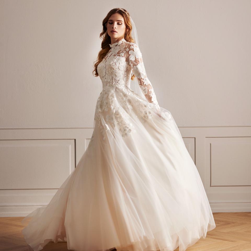 Exquisite bridalgown with floral lace with hints of blush and silver
